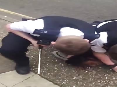 Police in Street Fight while arresting suspect
