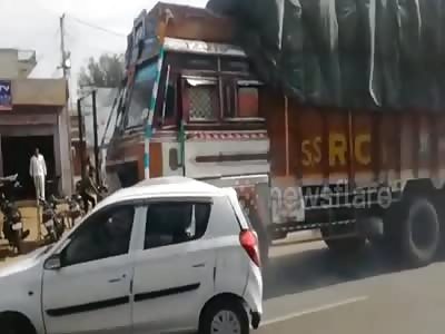 Demonic truck driver drags car down road for 3km with driver still ins