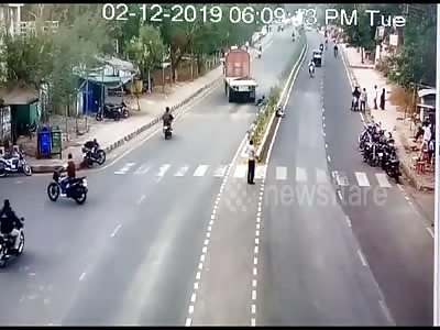 Survives a motorcycle riders as truck driver make a dramatic turn....