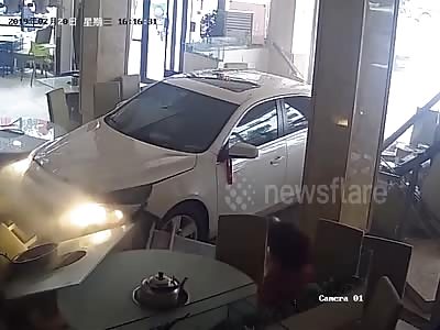 Nervous newbie driver plunges car into restaurant...