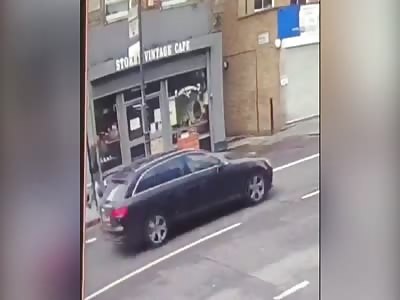 Pedestrian narrowly avoids being crushed by collapsing roof in London
