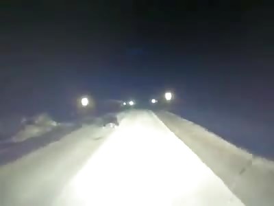 A drunken Russian who sleeps on the road passes a car