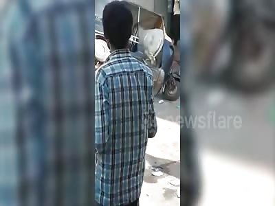 Warring bull gets stuck inside auto rickshaw in western India