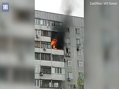 Boy escapes blazing tower block inferno from eight-floors-up