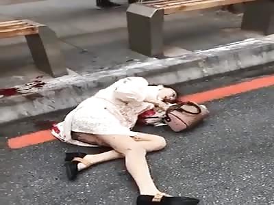 Woman Lies Helplessly on the Street after Being Attacked