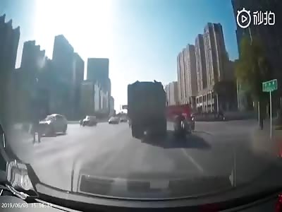 Motorcyclist Flattened by Dump Truck