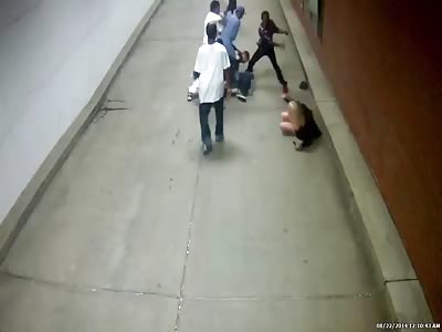 man beaten by a group of blacks