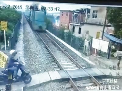 Dude On Bike Unable to Beat the Train