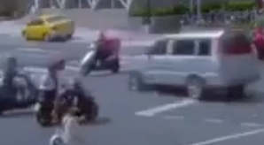 Scooter Woman Doesn't Make the Intersection