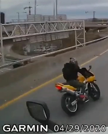 Motorbiker Falls From Overpass After Hitting Barrier
