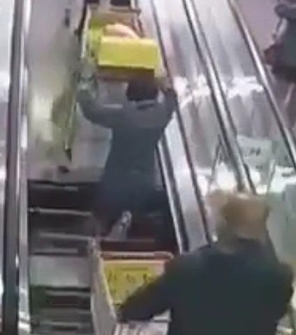 Guy Gets Swallowed by Escalator