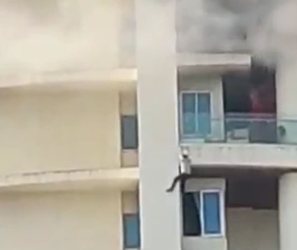 Man Falls From Burning High Rise Apartment Complex