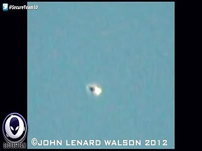 EERIE UFO Morphs In The Sky Near Passing Airliner