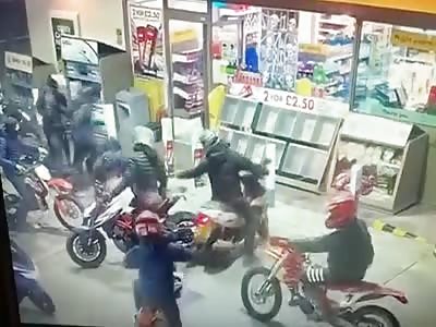 Youths on scooters invade Shell filling station
