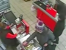 LOL: Tense moment when a cashier simply ignores her would-be robber