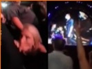 Slutty girl sucks off boyfriend on dancefloor during concert.