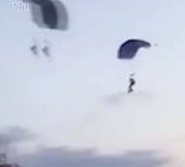 Woman falls to her death as two parachutists collide mid-air