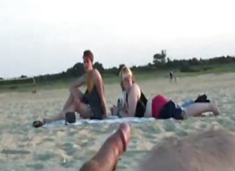 Pervert cums at the beach in front of strangers.