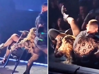 Dancer Pulls Chair...Madonna's Old Ass Wipesout .. Lol