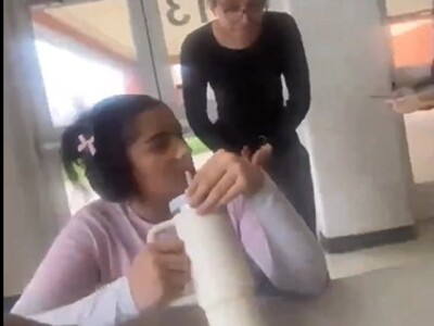 Girl Being Bullied Recycles Plastic Bottle on Face