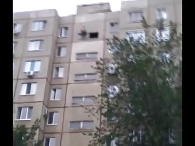 Man Contemplates his Life for a While then Ends it From his Balcony Window