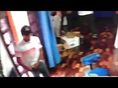 Thief Gets Beaten by Customer with a Chair while Store Owner Fights with Him