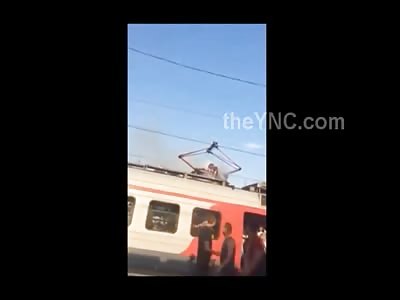 Man Frying on Top of a Train