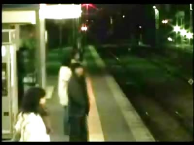 Asian Man walks in Front of Train but No One Notices...
