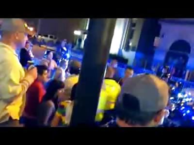 Kid Smashes a Bottle then Swings on a Police Officer at Mardi Gras 