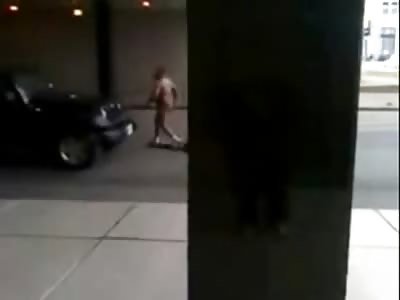 Raving Naked Man decides to Fight a Moving Car