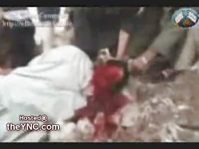 Disturbing and Graphic Video shows a Young Boy behead an Allegded Spy. UNCENSORED
