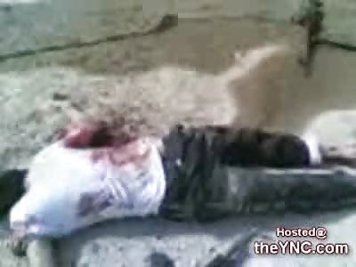 Iraqi Soldier celebrates over the Bodies of 4 Very Dead Terrorists