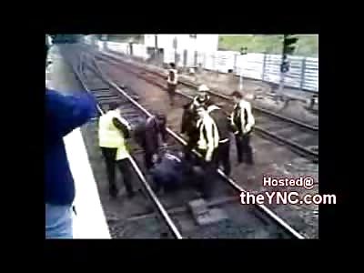 Police Forcefully Rescue Couple Trying to Commit Suicide by Train.