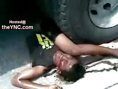 Extraordinary: Man Wedged Under Truck Wheel is Screaming for Help as Onlookers Watch him Suffer