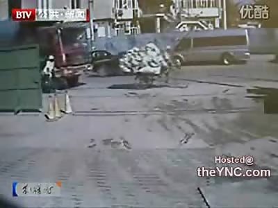 Dump Truck Runs over Man on Bike Crushing Him Under the Tires