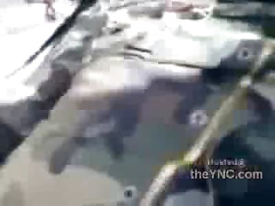 Rebels in Libya Sprawled out on Road .. This Dudes Brain Leaking out of His Head