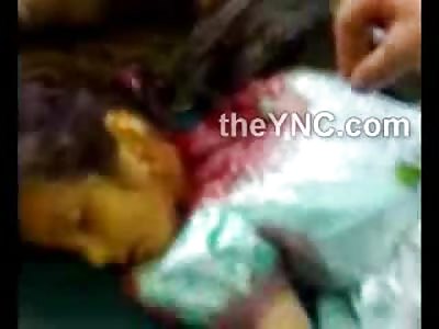 SHOCK: Young Female Child was Beheaded in her Blue Dress with a Knife (Graphic Video)