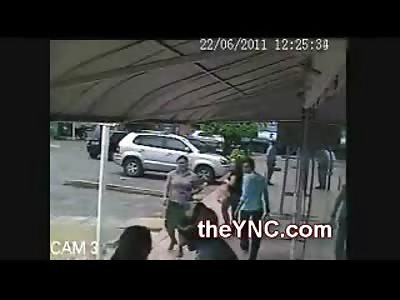 Asshole with a Helmet almost gets Shot trying to Steal Purse from a Big Woman