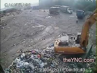 Construction Worker watching Backhoe Dig is Run Over by the Dump Truck