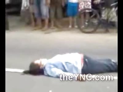 Woman Convulsing on the Street and the Traffic could Care Less!!