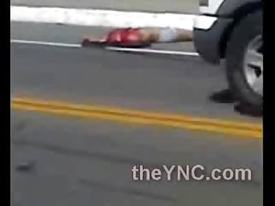 Cars Try to Drive in Between the Body and the Decapitated Head