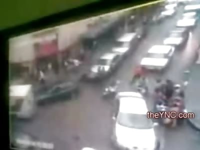 Clueless Female Driver Reverses and Tramples Everyone at an Intersection