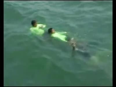 Alien looking Man with a Raging Hard On is Pulled out of the Water and Examined Stabbed to Death)