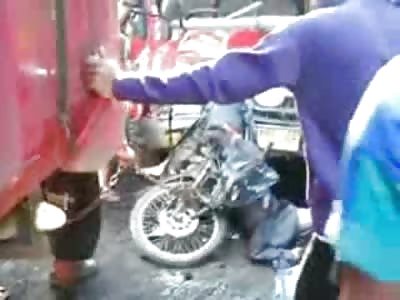 Trying to Unhitch the Dead Biker from the Hood Isn't that Easy-