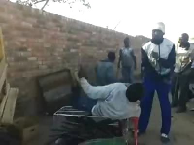 Two Men in Zimbabwe are Beaten on Top of Shopping Carts by Mob of Street Vendors