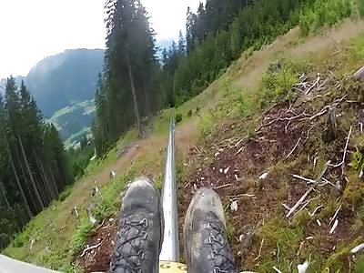 Lunatic on an Alpine Coaster takes out a Slower Girl for being Slow