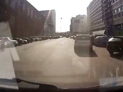 Biker and his Motorcycle Literally end up inside and Illegal U-Turning SUV