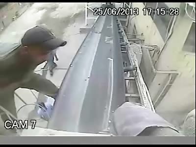 Careless Worker Gets Sucked into a Conveyor Belt