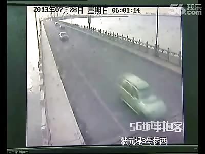 Driver is Ejected after Crashes on a Bridge Nearly Falling over the Side