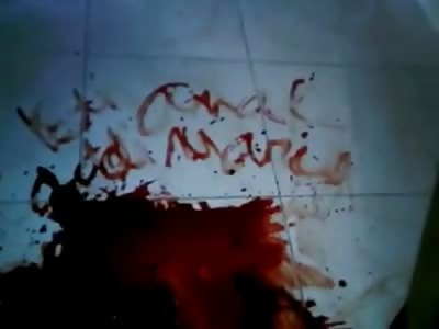 Better Quality Video of Man still Alive Scalped lying in Blood next to his Dead Wife with Writing in Blood